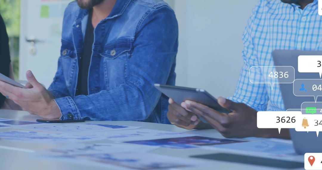 Team of Professionals Analyzing Data with Digital Interfaces