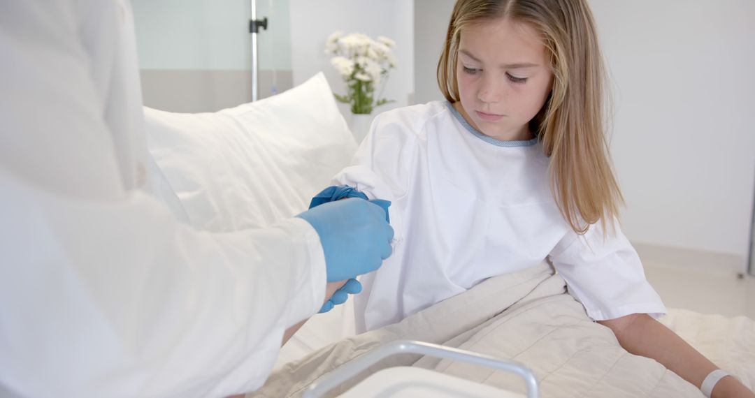 Doctor Collecting Blood Sample from Young Girl in Hospital - Free Images, Stock Photos and Pictures on Pikwizard.com