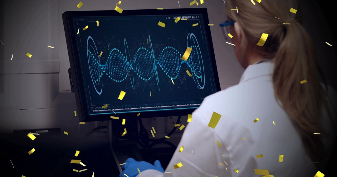 Laboratory scientist analyzing waveform on monitor wearing blue gloves with gold confetti