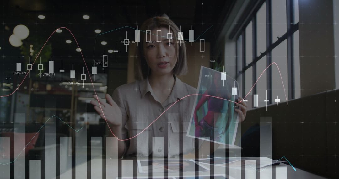 Businesswoman in virtual meeting with graph overlays