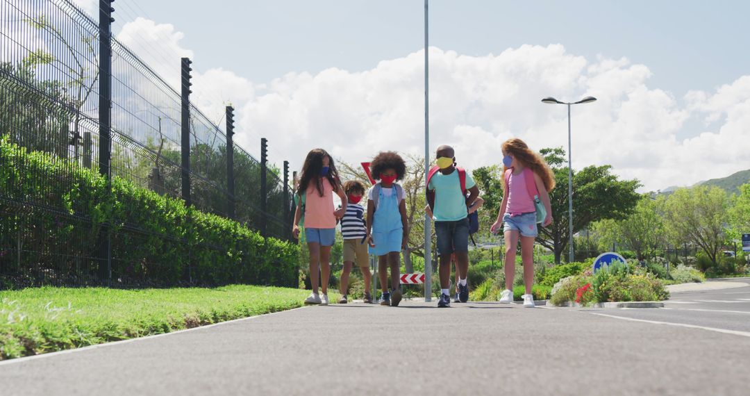 Diverse Group of Kids Walking on Sunny Pathway Outdoors - Free Images, Stock Photos and Pictures on Pikwizard.com