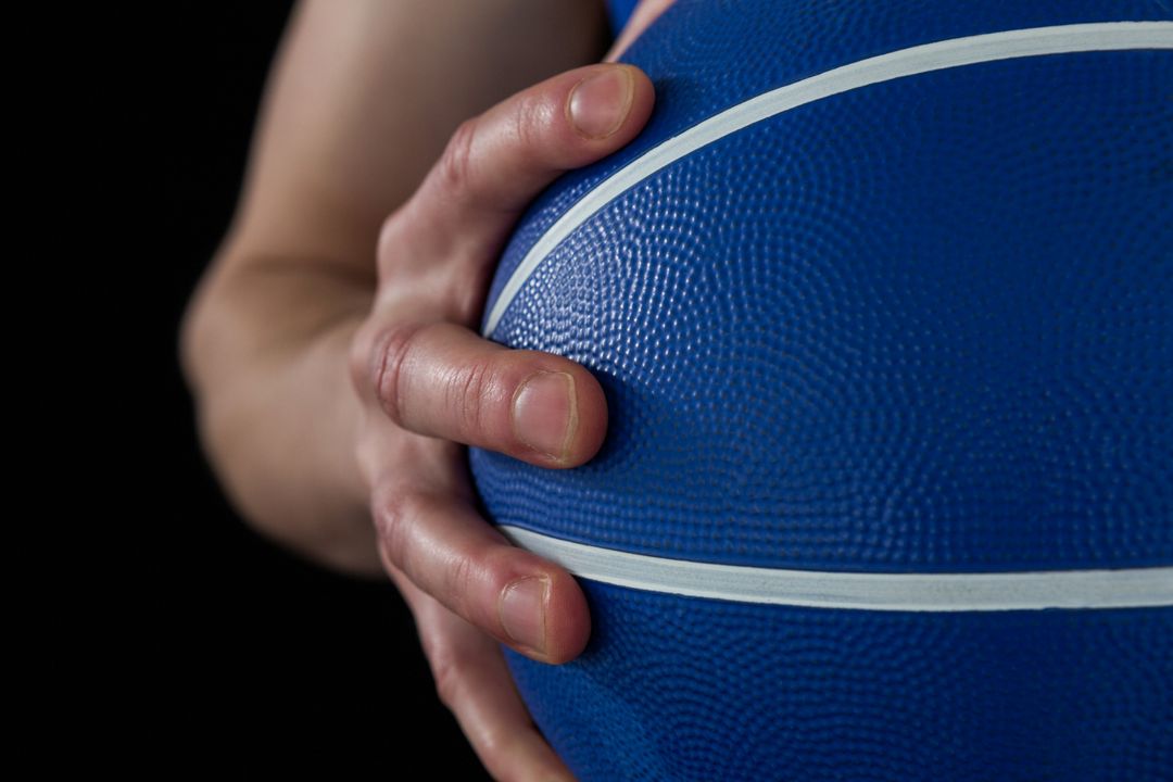 Close-up of Player Holding Blue Basketball - Free Images, Stock Photos and Pictures on Pikwizard.com