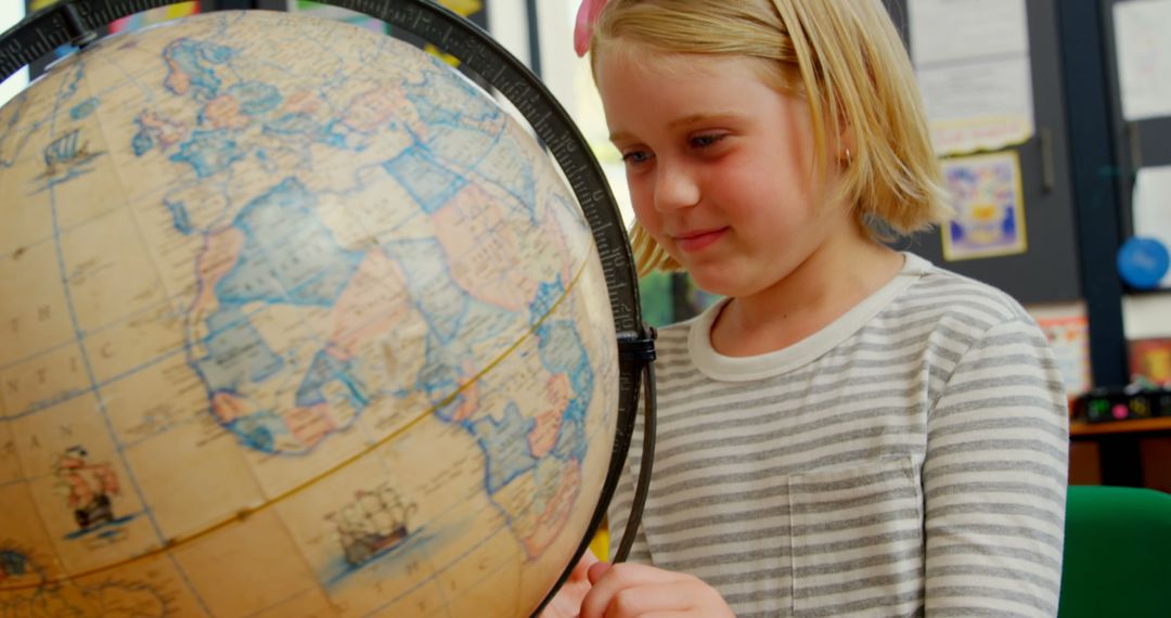 Curious Schoolgirl Exploring Globe in Classroom Education Concept