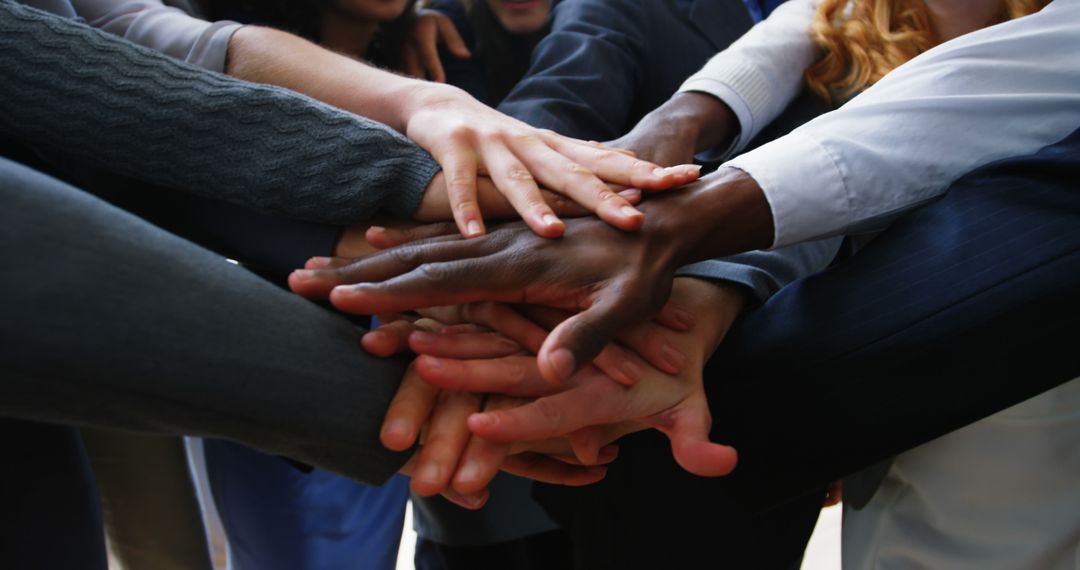 Diverse Team with Hands Piled Together in Unity - Free Images, Stock Photos and Pictures on Pikwizard.com