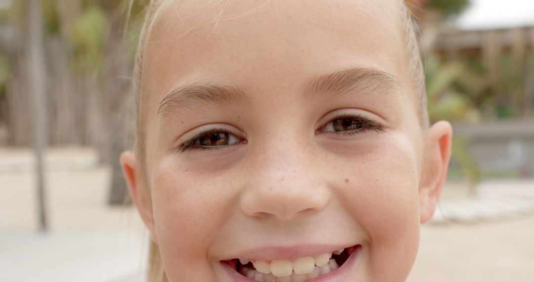 Close-up of Smiling Young Girl Outdoors - Free Images, Stock Photos and Pictures on Pikwizard.com