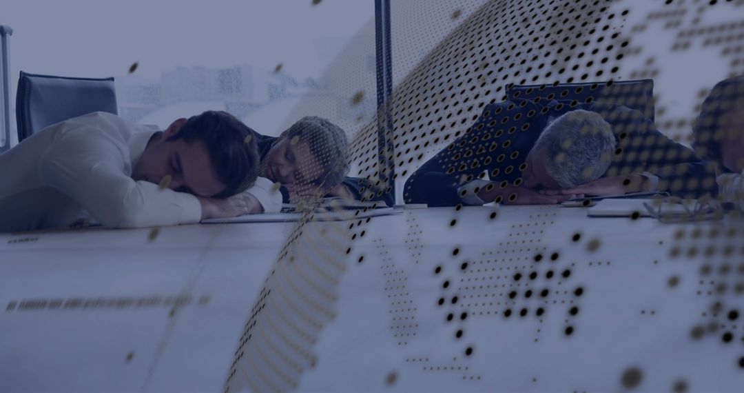 Overworked Employees Sleeping at Desk in Modern Office