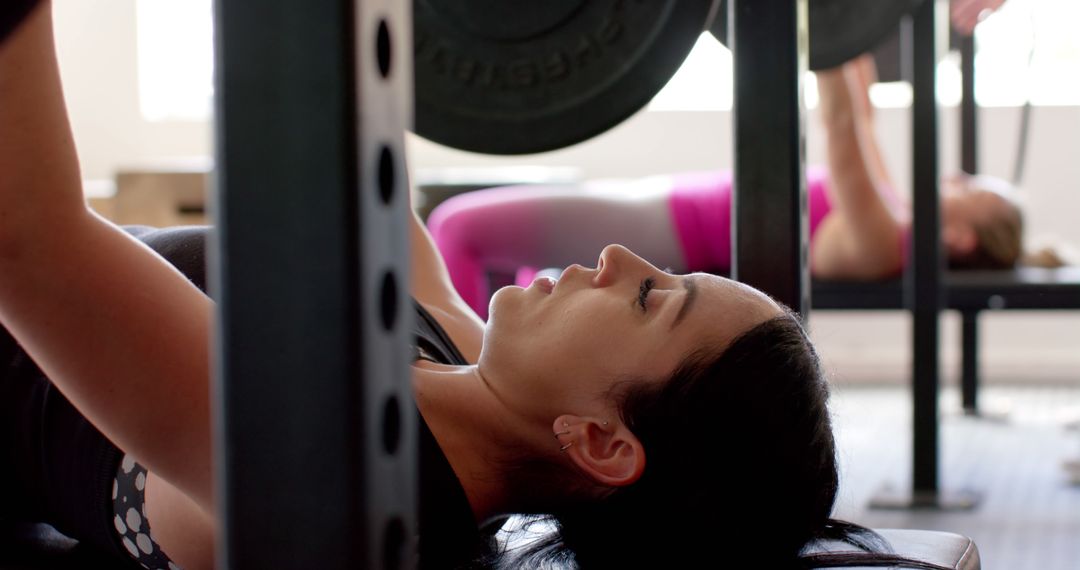 Women Performing Bench Press Exercise at Gym - Free Images, Stock Photos and Pictures on Pikwizard.com