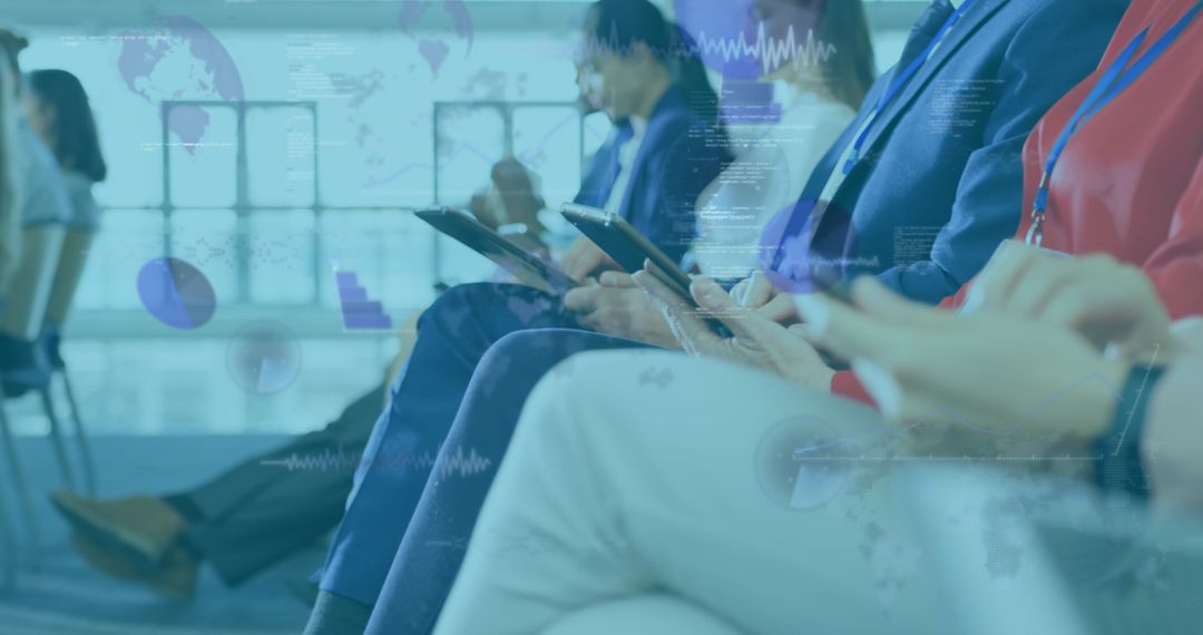 Diverse Business Professionals Engaged with Digital Interfaces