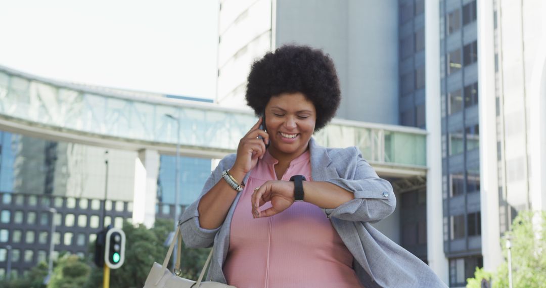 Joyful Professional with Smartwatch Walking in Urban Environment