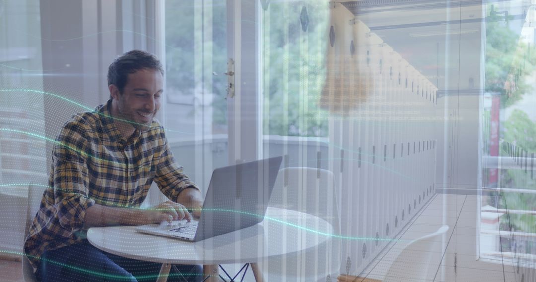 Man Working on Laptop in Cozy Home Workspace with Locker Reflection