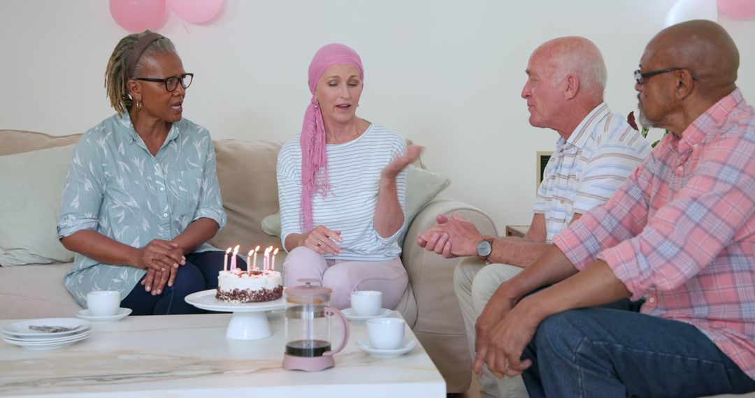 Senior friends celebrating birthday with cake and conversation