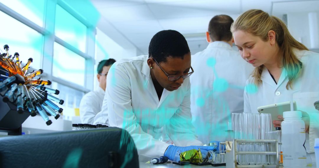 Diverse Scientists in Laboratory Conducting Research with Digital Interface