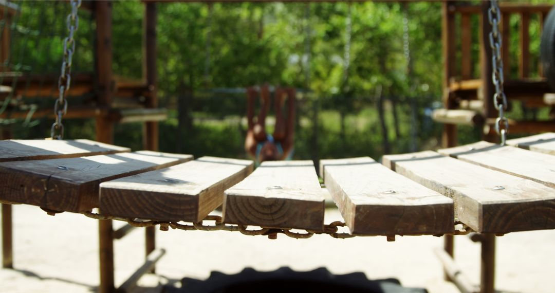 Defocused View of Playground Bridge with Child Playing - Free Images, Stock Photos and Pictures on Pikwizard.com