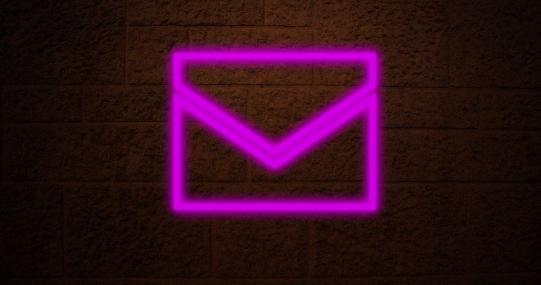 Neon Email Icon Illuminating Brick Wall