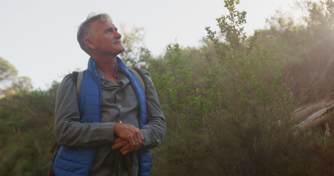 Older Adult Man Smiling in Nature While Hiking - Free Images, Stock Photos and Pictures on Pikwizard.com