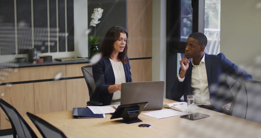 Business Meeting with Global Data Overlaying Table Discussion