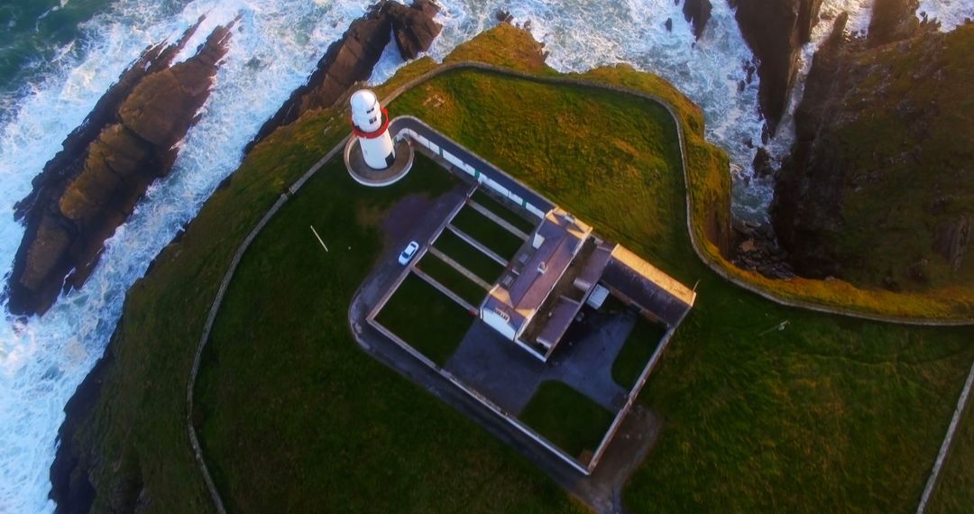 Aerial View of Seaside Lighthouse on Clifftop During Golden Hour - Free Images, Stock Photos and Pictures on Pikwizard.com