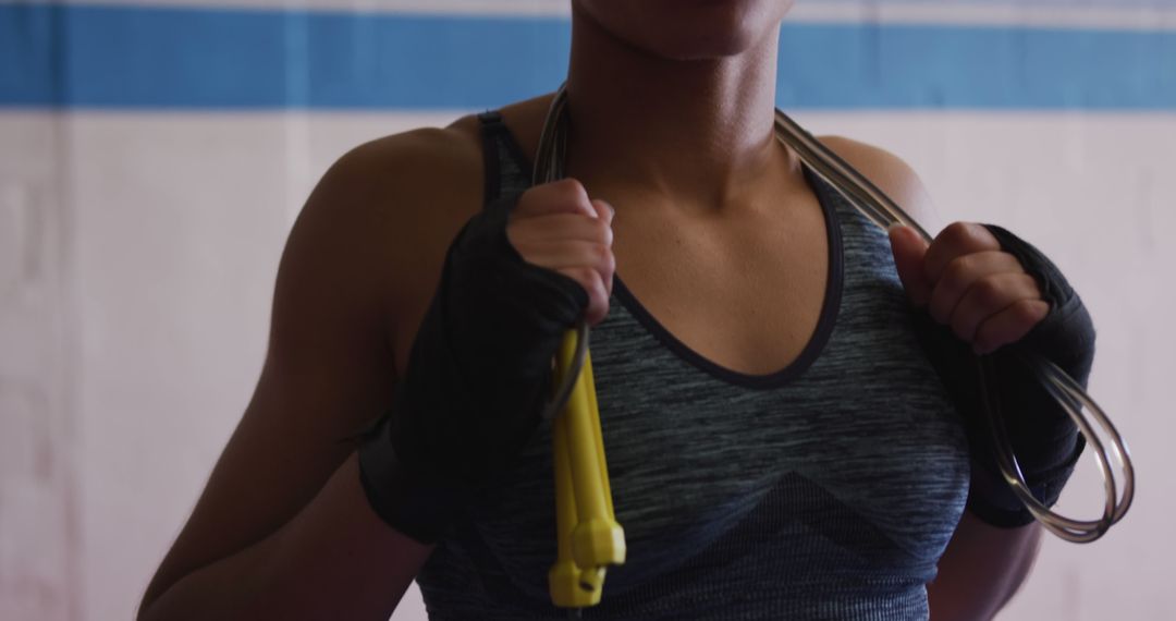 Female Boxer's Midsection Holding Jump Rope in Training Facility - Free Images, Stock Photos and Pictures on Pikwizard.com