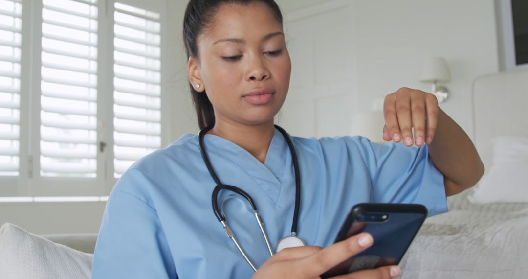 Female Healthcare Worker Typing on Smartphone at Home Office with Natural Light - Free Images, Stock Photos and Pictures on Pikwizard.com