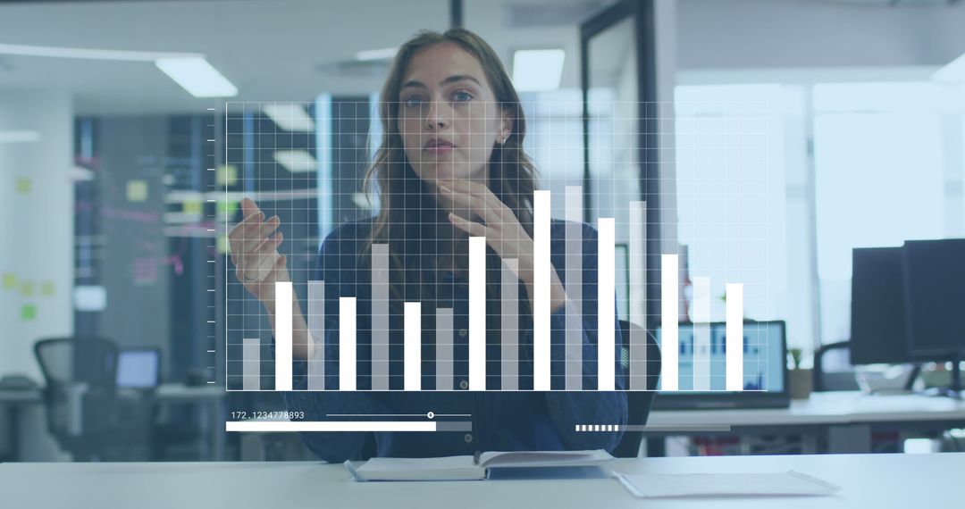Businesswoman Analyzing Data with Digital Graph Interface