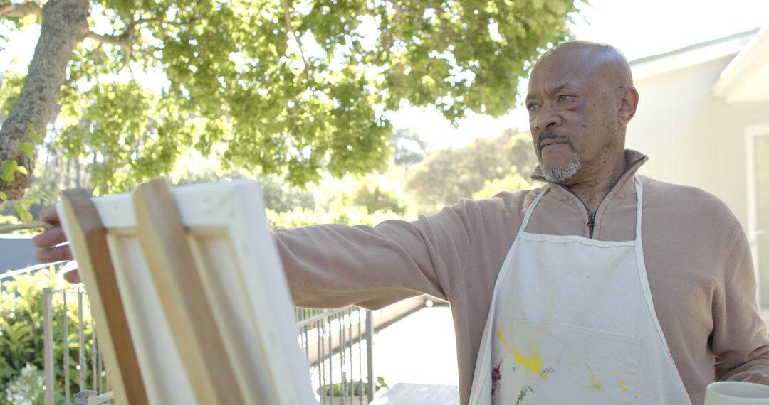 Senior Man Painting Outdoors on Sunny Day - Free Images, Stock Photos and Pictures on Pikwizard.com