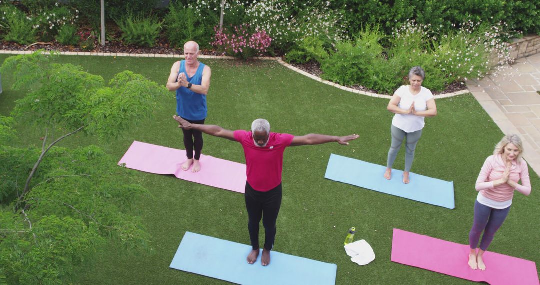 Diverse Group Practicing Outdoor Yoga on Colorful Mats - Free Images, Stock Photos and Pictures on Pikwizard.com