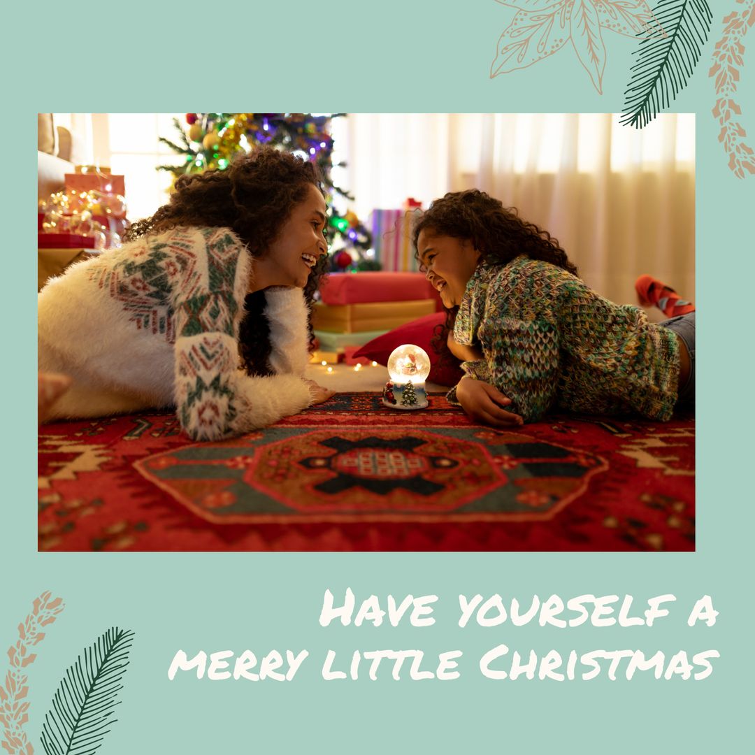 Mother and Daughter Enjoy Quality Time with Christmas Snow Globe