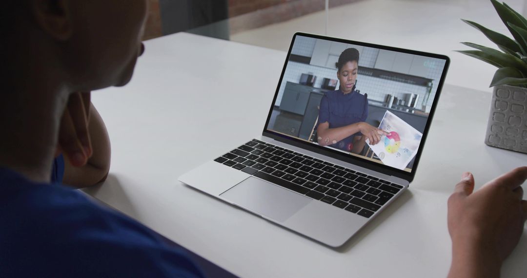 Remote Learning Session in Modern Office Setting with Laptop