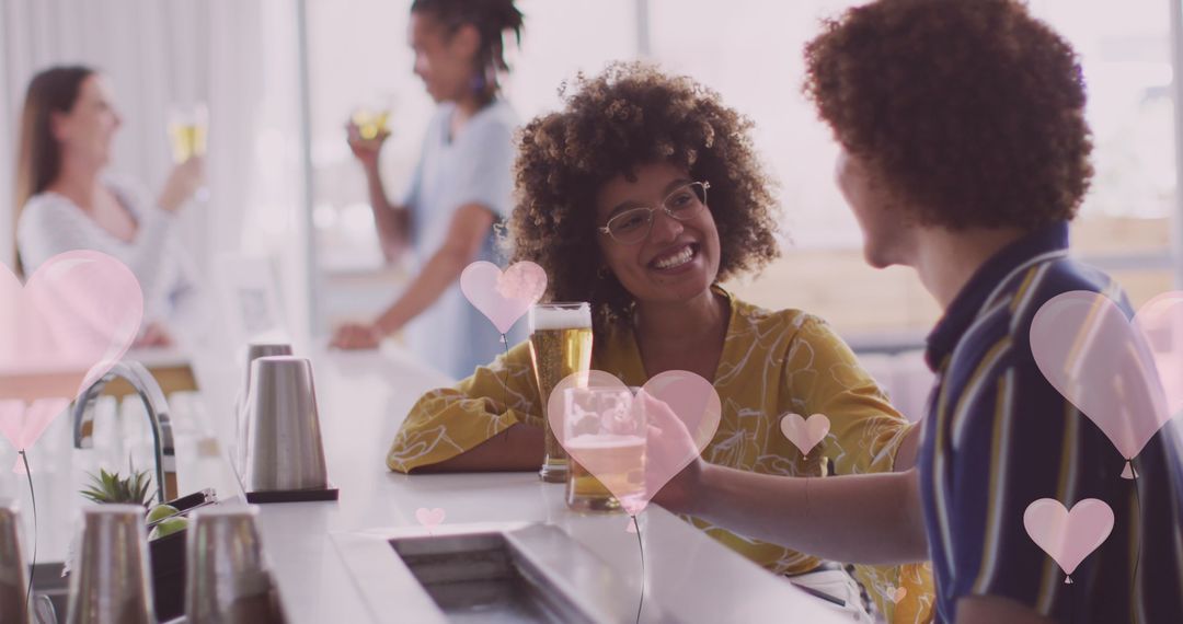 Diverse Friends Enjoying Beverages with Heart Icons Overlay