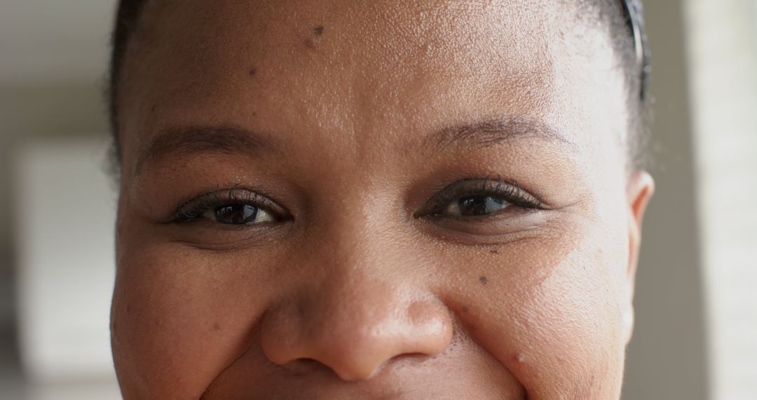 Close-Up of Smiling African Woman with Natural Makeup and Happy Expression - Free Images, Stock Photos and Pictures on Pikwizard.com