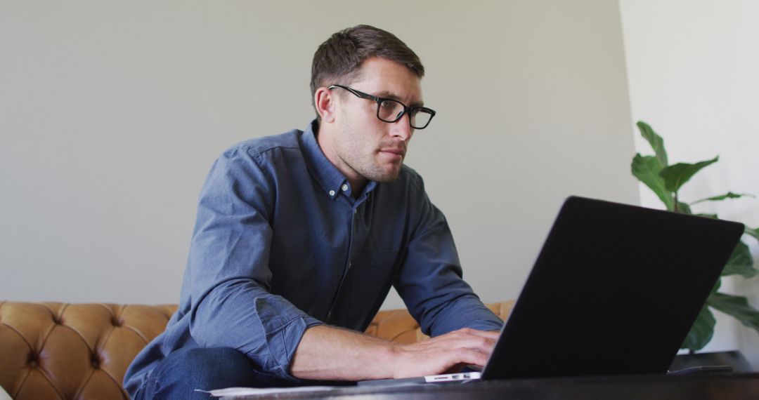 Focused Professional Working Remotely in Home Office Setup