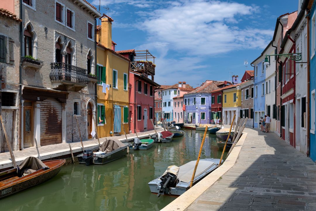 Colorful Canal Street with Boats in Picturesque Italian Town - Free Images, Stock Photos and Pictures on Pikwizard.com