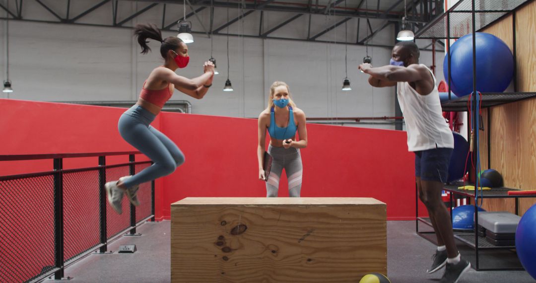 People Working Out in Gym with Face Masks - Free Images, Stock Photos and Pictures on Pikwizard.com