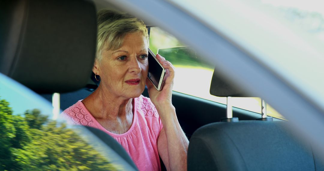 Senior Woman Using Smartphone While Driving - Free Images, Stock Photos and Pictures on Pikwizard.com