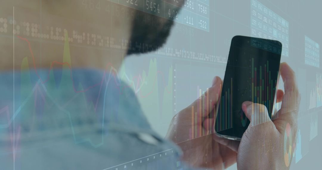 Bearded man holding smartphone viewing live stock charts with ticker and candlesticks