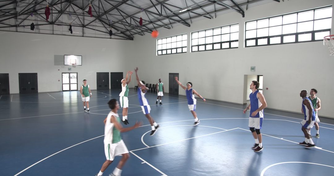 Energetic Basketball Play in Indoor Game Setting
