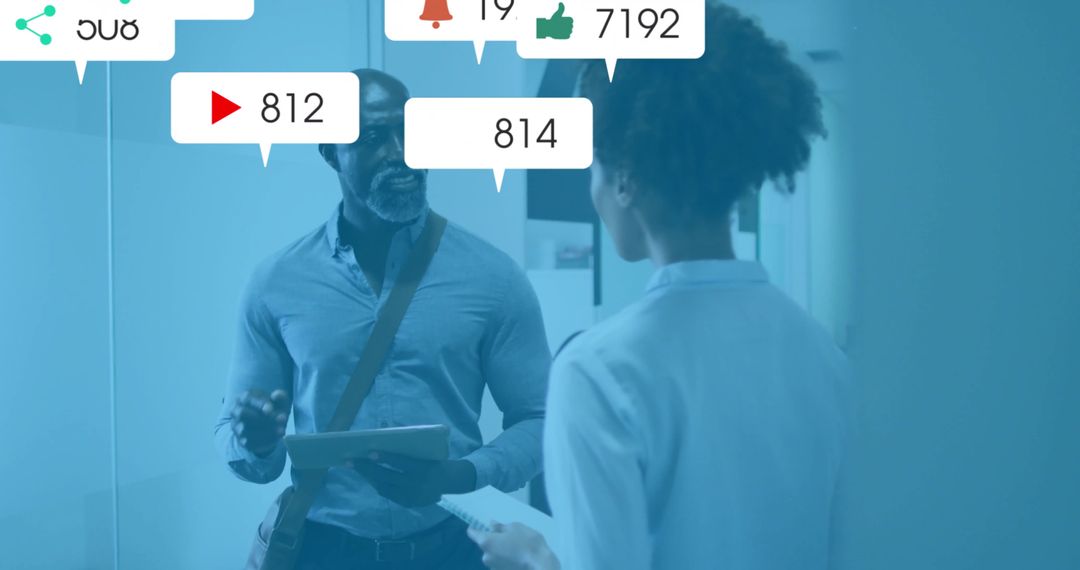 Colleagues Discussing Data with Floating Social Media Icons