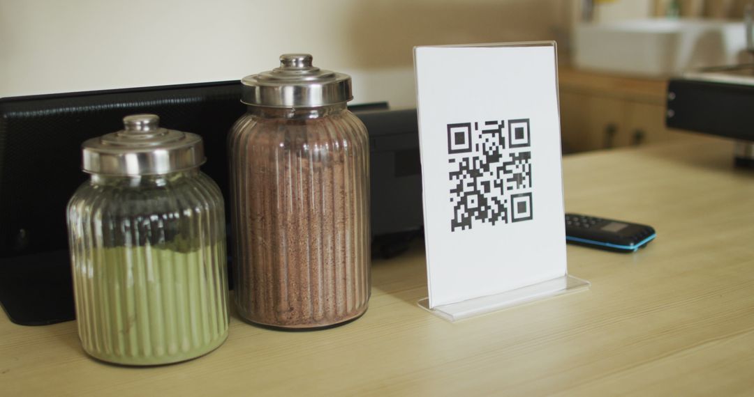 QR Code Display on Counter Near Jars of Ingredients - Free Images, Stock Photos and Pictures on Pikwizard.com