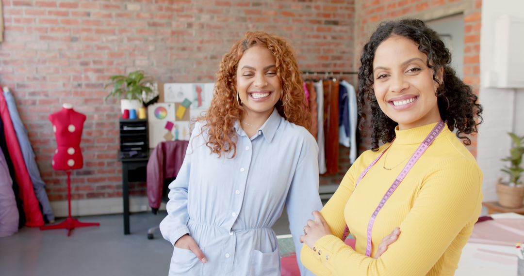 Two Smiling Female Fashion Designers in Studio - Free Images, Stock Photos and Pictures on Pikwizard.com