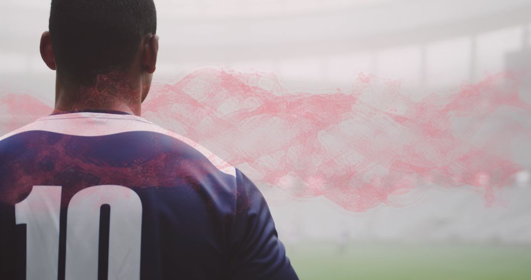 Rugby Player in Stadium Surrounded by Smoke Trails