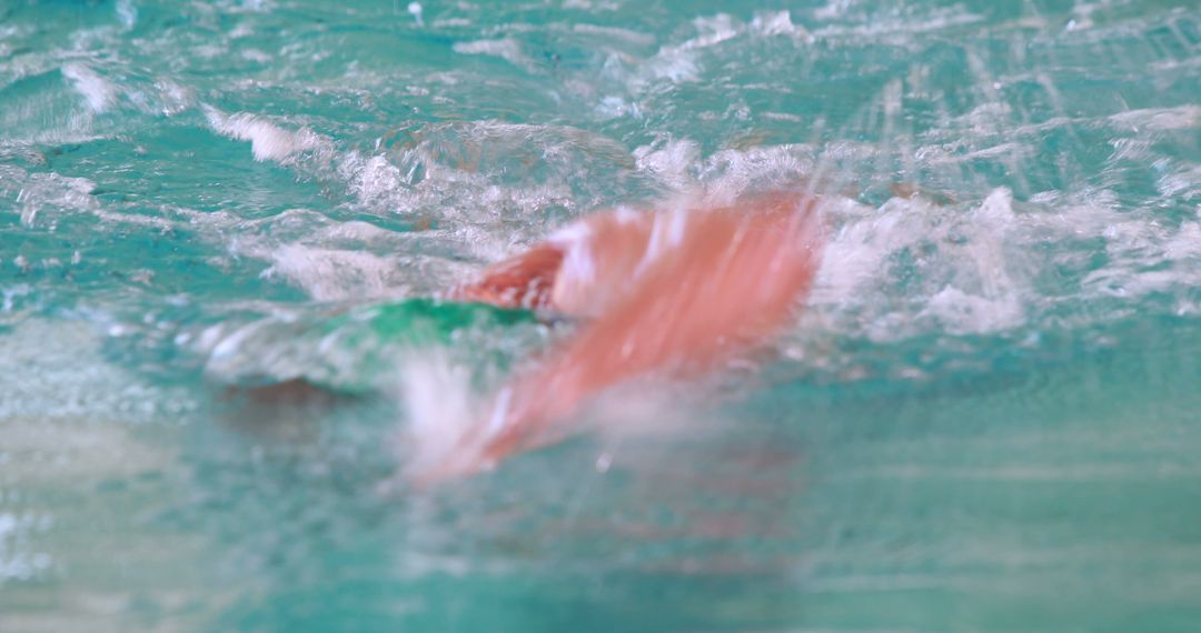 Blurred Swimmer in Pool Capturing Motion and Speed - Free Images, Stock Photos and Pictures on Pikwizard.com