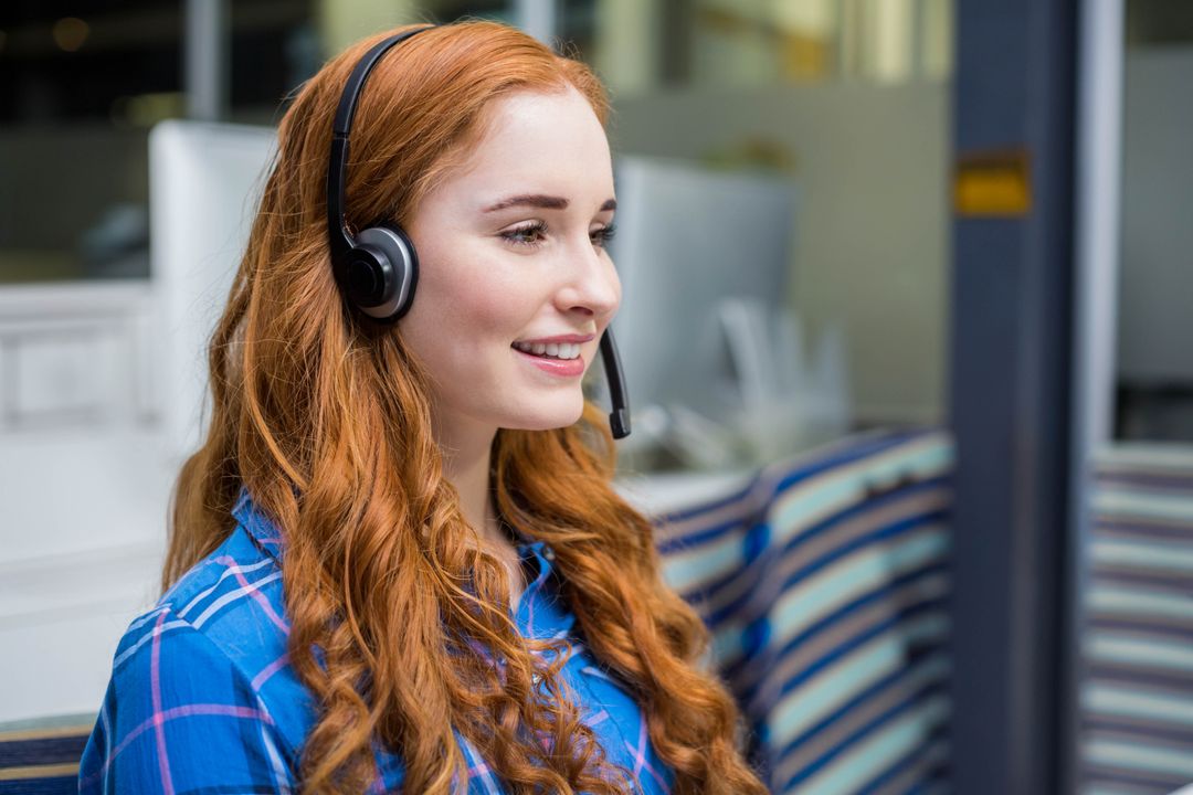 Call Center Agent Communicating with Customer Using Headset