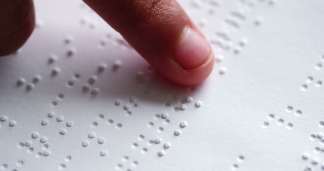 Close-Up of Finger Reading Braille Text on Paper - Free Images, Stock Photos and Pictures on Pikwizard.com