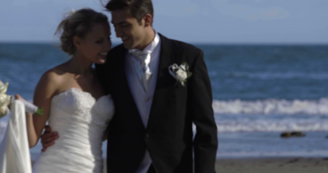 Newly Married Couple Embracing on Beach at Sunset - Free Images, Stock Photos and Pictures on Pikwizard.com