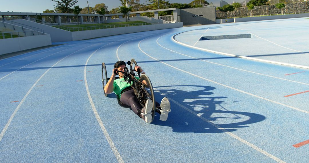 Athlete Practicing on Racing Handcycle on Outdoor Track - Free Images, Stock Photos and Pictures on Pikwizard.com