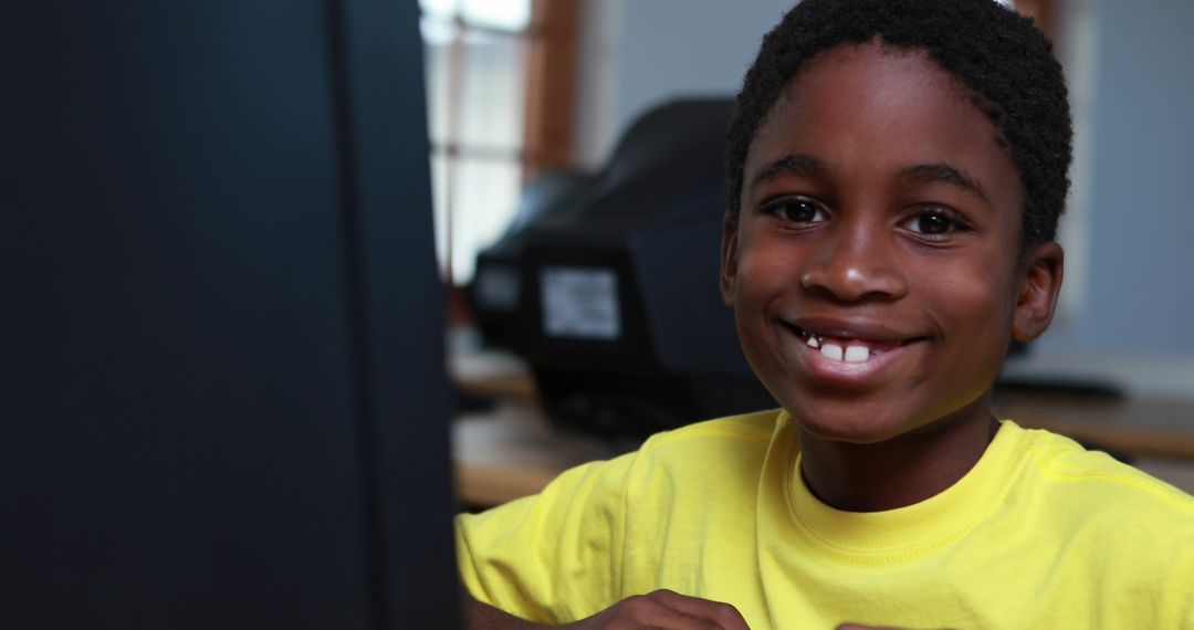Happy Boy Enjoying Computer Class in School