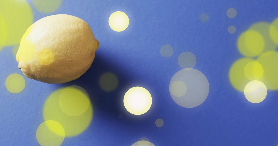 Vibrant Lemon with Bokeh Lights on Blue Backdrop