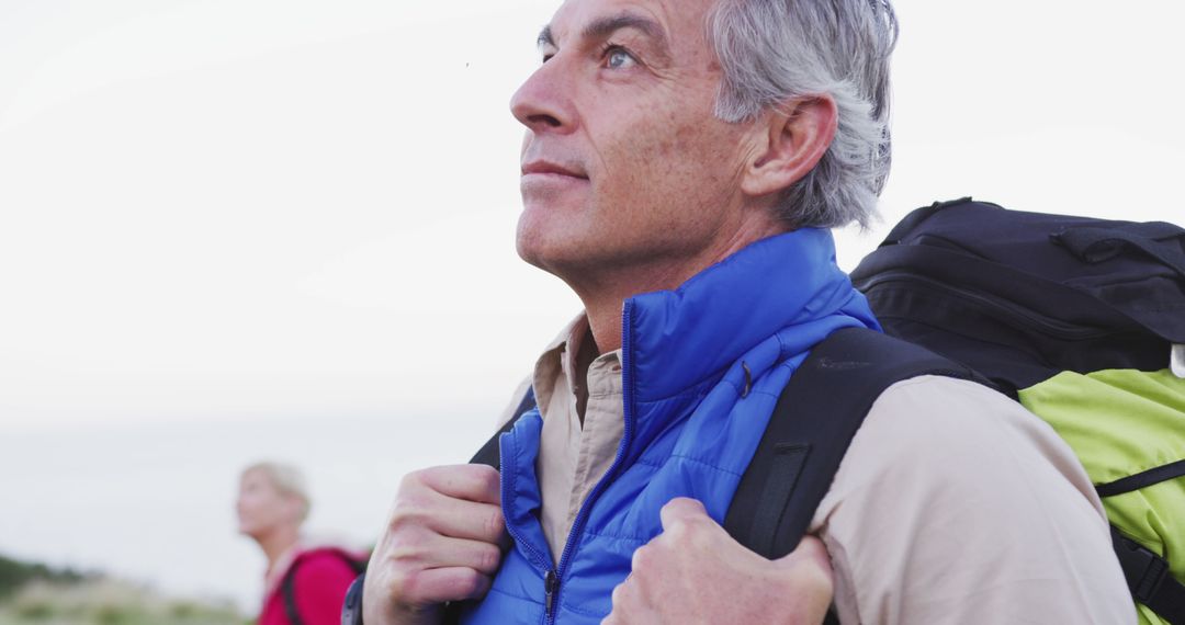 Senior Hiker Enjoying Mountain Adventure and Landscape