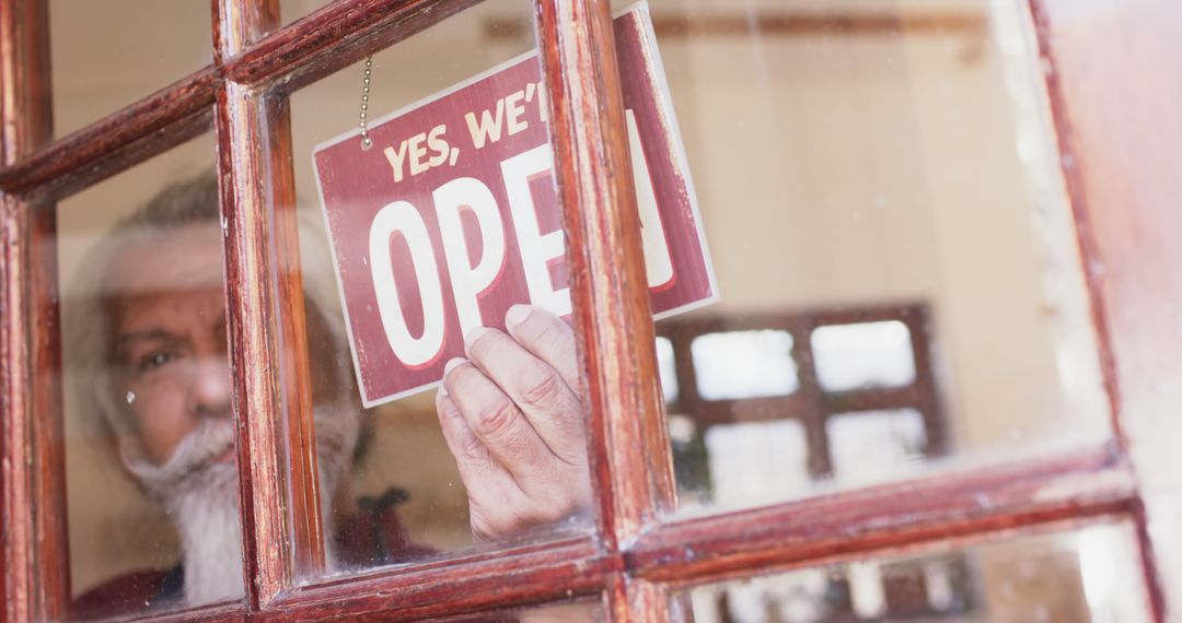 Senior Man Placing Open Sign on Glass Door of Small Business - Free Images, Stock Photos and Pictures on Pikwizard.com