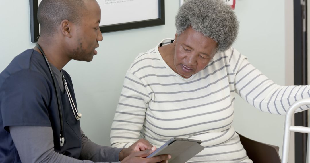 Doctor Discussing Test Results with Elderly Patient in Clinic - Free Images, Stock Photos and Pictures on Pikwizard.com